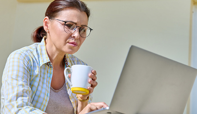 Woman on computer on porch